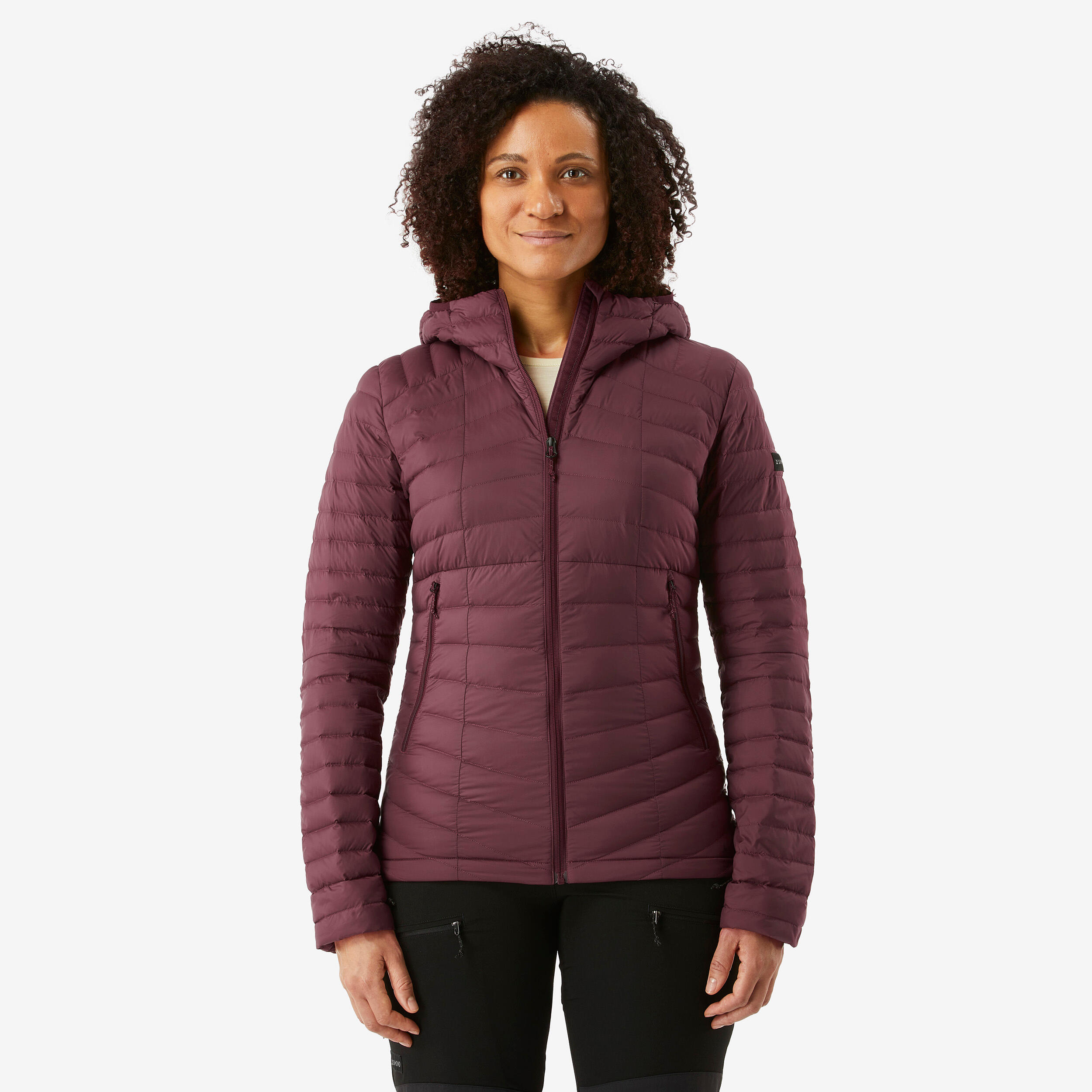plumifero-979vbt-1.jpg Plumífero de montaña y trekking con capucha Mujer Forclaz MT100 - Imagen 1